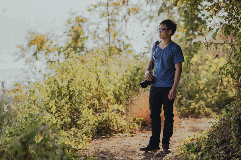 real people, black, males, contemplation, walking, dslr, camera, one Person, adults Only, asian, shirt, color Image, image Type, smiling, outdoors, people