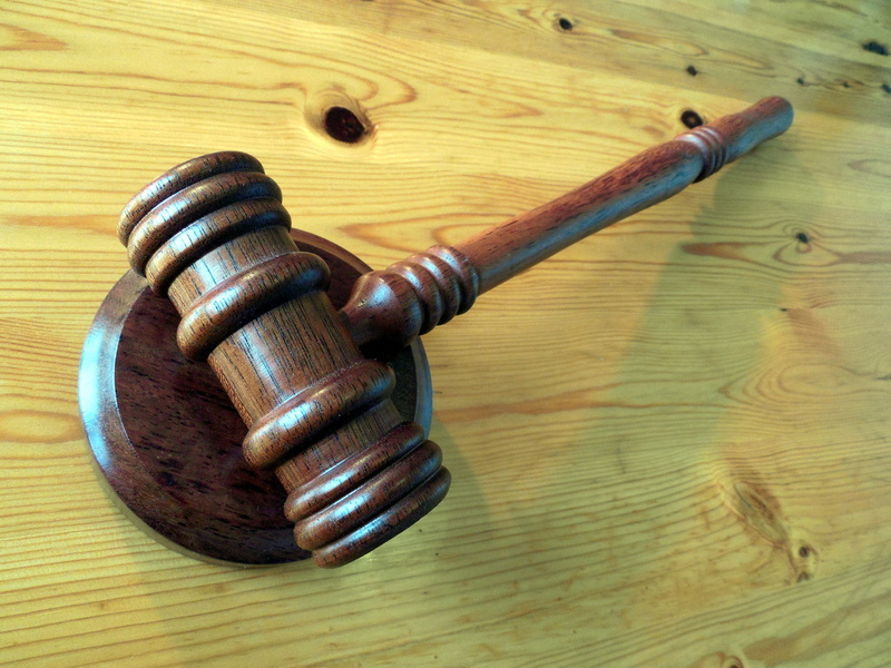 metal, work tool, justice - concept, wood - material, case law, tool, table, auctioneer, still life, law, mallet, black color, legal system, clause, high angle view
