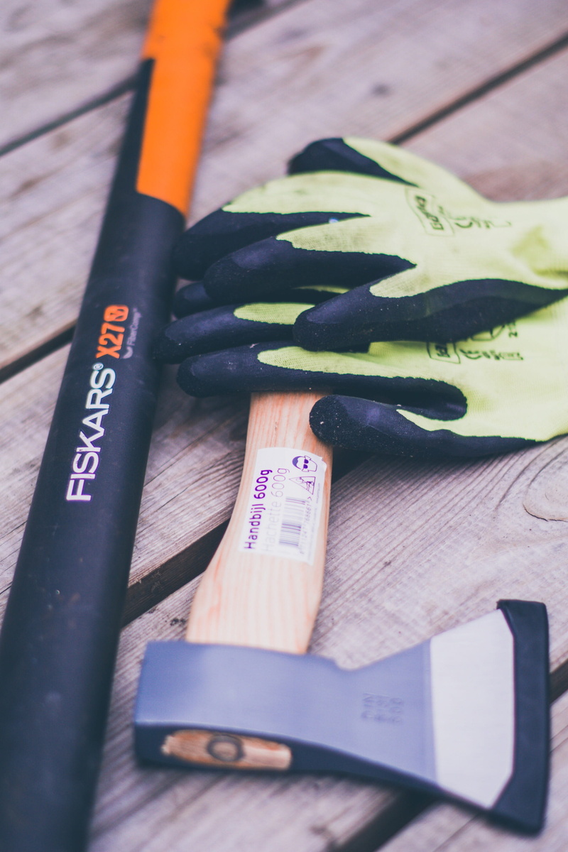 finger, gloves, wood - material, pencil, paint container, indoors, no people, brush, still life, vegetable, kitchen knife, text, selective focus, peel