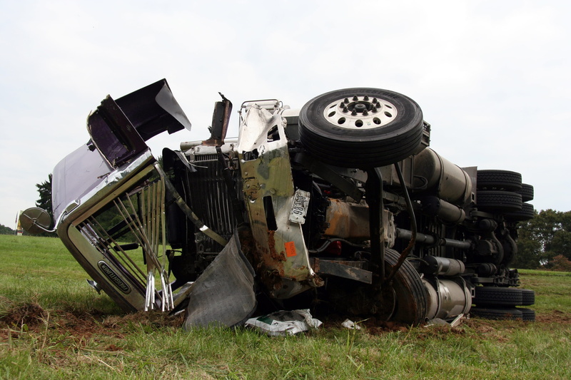 outdoors, land vehicle, semi truck, no people, sky, grass, agricultural equipment, land, truck, 2K, agricultural machinery, accident, semi, metal, tire