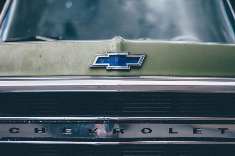 vintage, mode of transportation, land Vehicle, Chevrolet, rail transportation, built structure, mode of Transport, window, bumper, day, emblem, motor vehicle