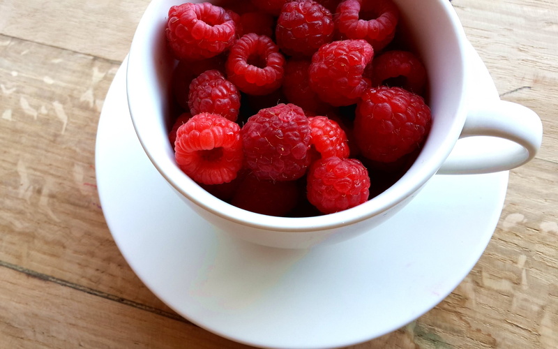 food and drink, raspberry, breakfast, fruits, wood - material, indoors, close-up, white, wellbeing, saucer, fruit, high angle view, cup, no people, refreshment