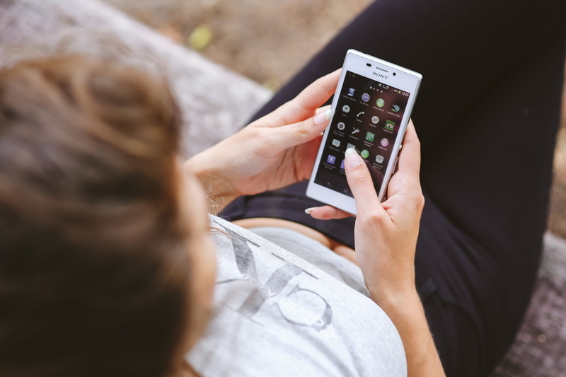 wireless Technology, mobile, people, high angle view, screentouch, technology, female, caucasian, casual clothing, two people, females, hand, telephone