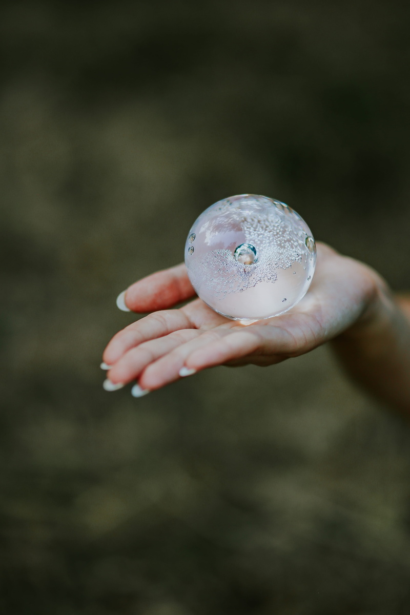 focus on foreground, 4K, crystal, glass building, close-up, ball, hand, nature, planet - Space, food and drink, day, little crystal, outdoors, women, hands