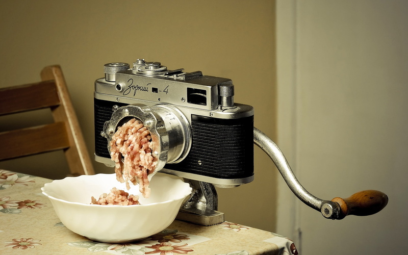 humor, technology, still life, meat, kitchen, table, grinder, camera, connection, food, indoors, home interior, domestic room, tabletop, close-up, nostalgia