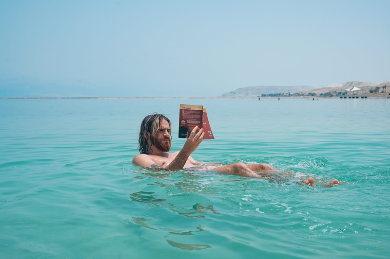 young adult, swimming pool, salty water, book, outdoors, real people, sea, lifestyles, waterfront, sports, portrait, reading, day, floating, leisure activities