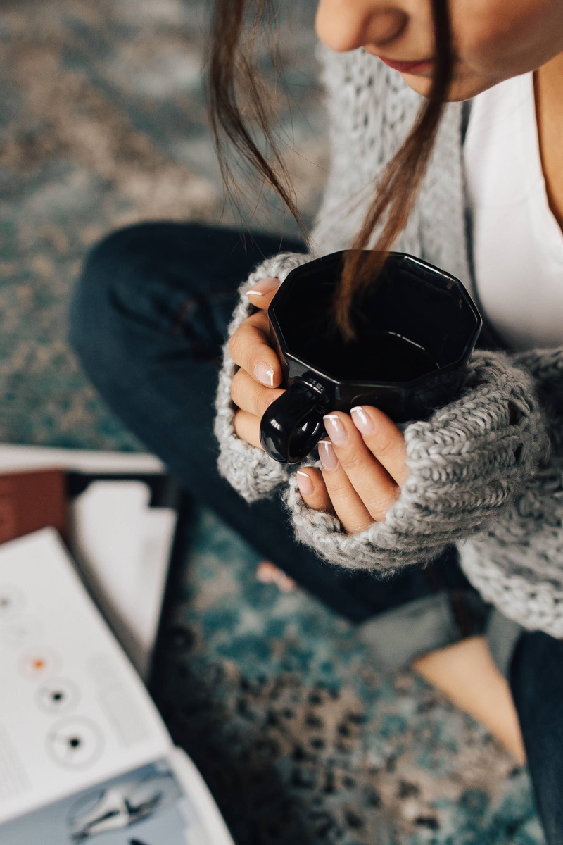 heat - Temperature, sweater, one woman only, real people, drink, adult, coffee Cup, tea, childhood, rest, cup of tea, people, day, books, holding, on the floor