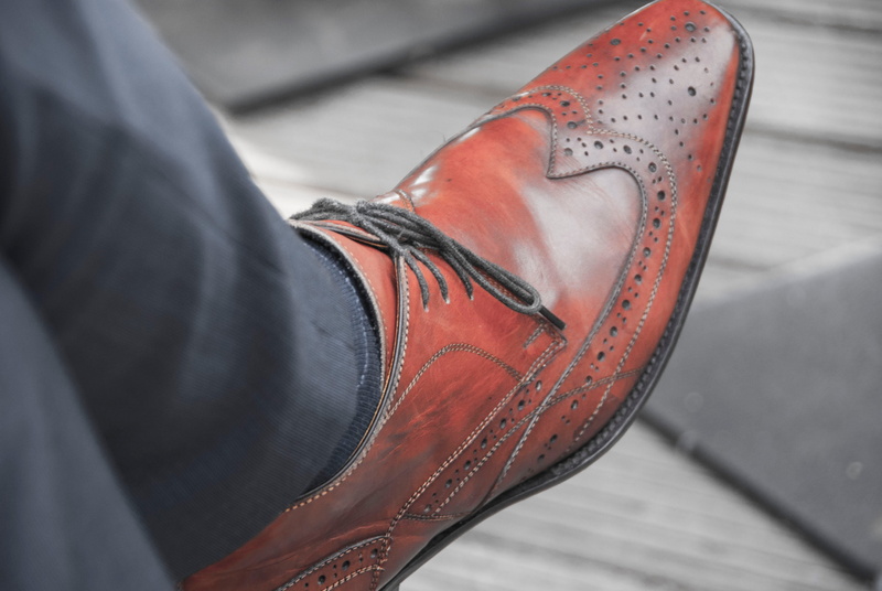 low section, human body part, red, jeans, lifestyles, 4K, human Foot, one person, leather, outdoors, fashion, person, men, limb, detaild, body part, day