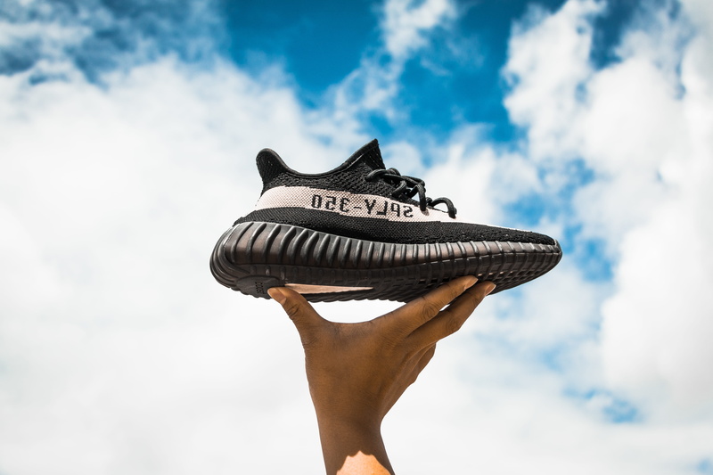 nature, finger, holding, v, craft, unpaired, hand, real people, human limb, human body part, adidas, day, shoe, one person, cloud - sky, s, 5K, low angle view