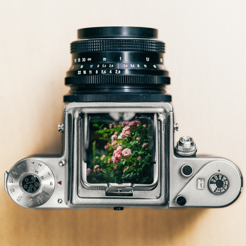 digital camera, still, film, lens, slr, table, photographic equipment, technology, retro styled, green color, close-up, grey, wall - building feature, dslr