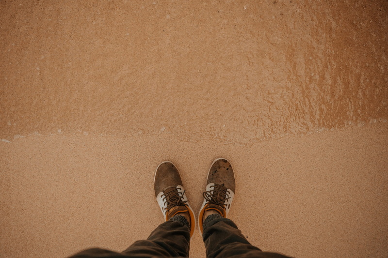 flat lay, looking down, real people, person, leisure activity, sea, personal perspective, feet, water, standing, high angle view, low section, shoes, sand beach