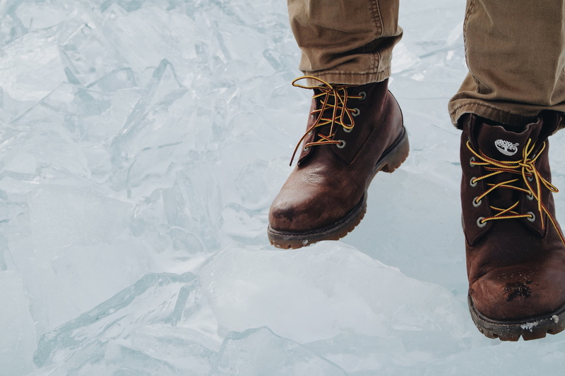 leisure activity, winter, warm clothing, ground, unrecognizable person, clothing, 4K, apparel, human, timberland, lifestyles, brown, low section, wearing