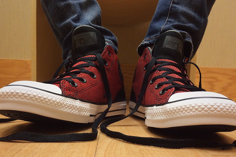 clothing, footwear, tops, red, shoe, fashion, converse, wearing, black, personal accessory, indoors, lace - fastener, pair, shoes, low section, leather