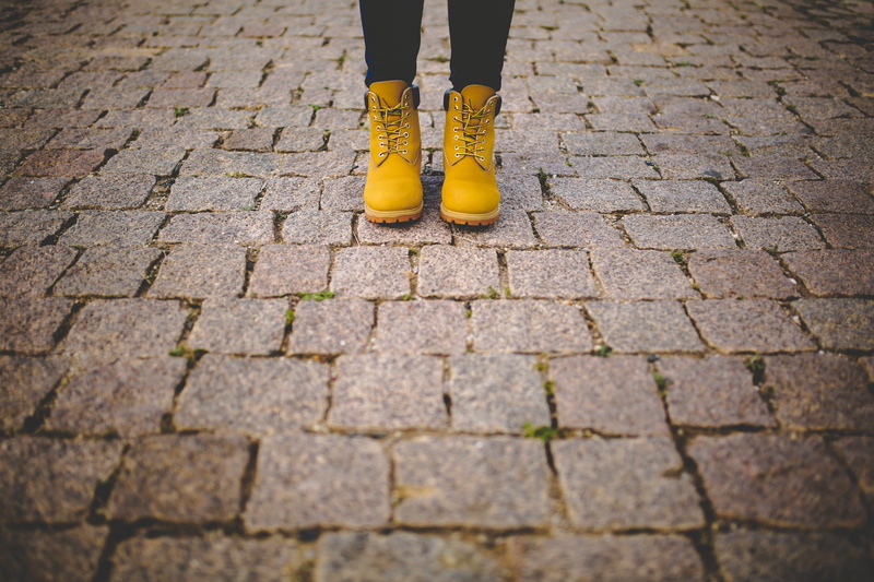 one person, street, cobblestone, wheat, paving stone, nubuck, boots, day, lifestyles, limb, women, outdoors, human limb, low section, 5K, footpath, pair
