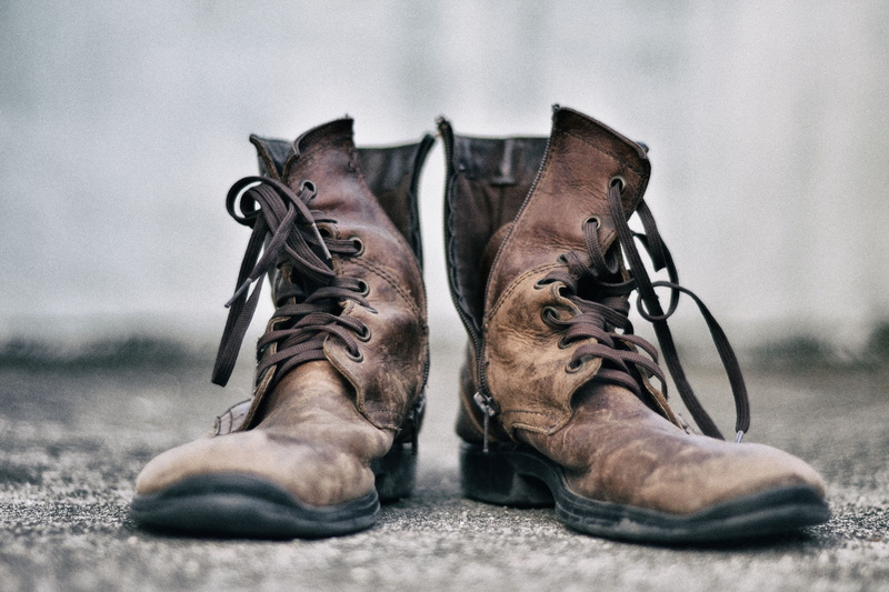 lace - fastener, leather, human leg, men, human foot, close-up, focus on foreground, boot, work, low section, boots, outdoors, real people, dirty, one person