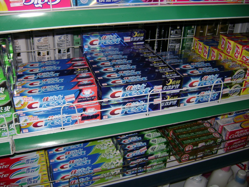 china, order, shelves, rack, row, text, box, shelf, no people, distribution, large group of objects, multi colored, arrangement, toothpaste, boxes, in a row