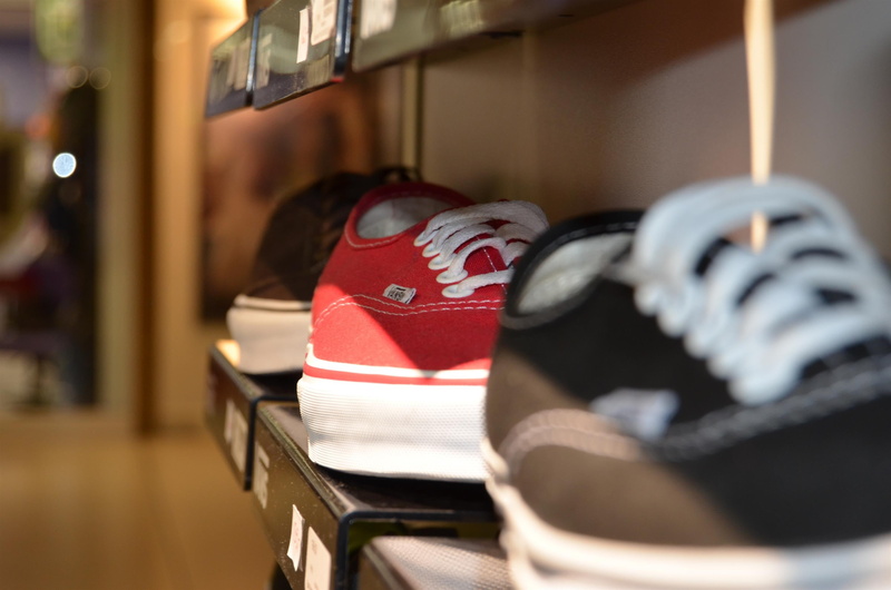 no people, business, sport, sneaker, leisure activity, absence, day, hanging, shelf, laces, table, fashion, shoes, close-up, shoe, pair, shop, focus on foreground