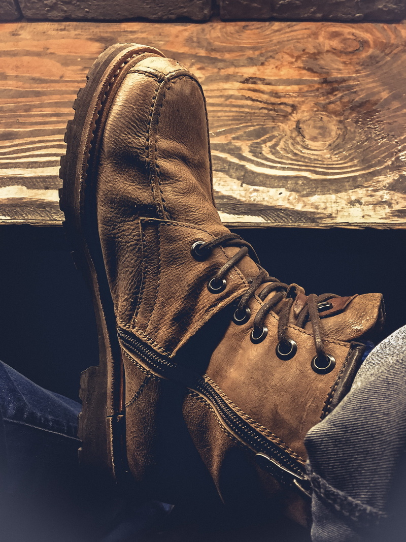 personal accessory, shoelace, classic, auto post production filter, close-up, boot, fashion, high angle view, brown, travel, shoe, person, single object