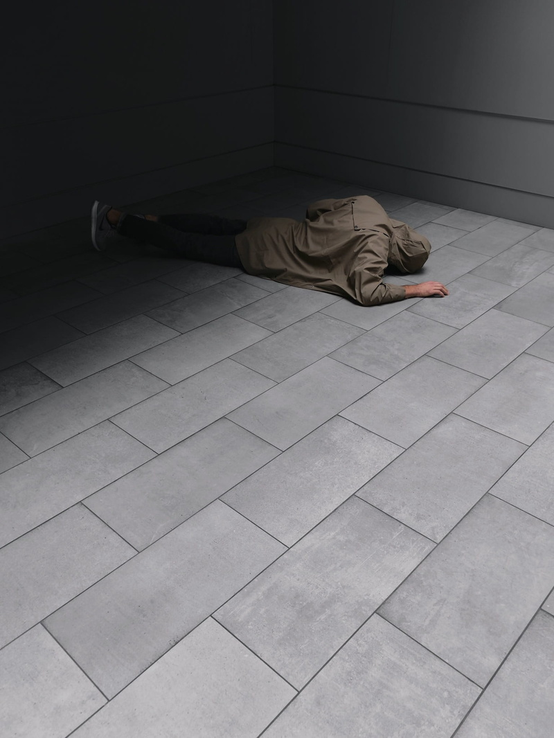 outdoorchallenge, man, black, despair, laying, tiled floor, shoe, sadness, person, men, grey, relaxation, tile, sleeping, mobilechallenge, fashion, hopelessness