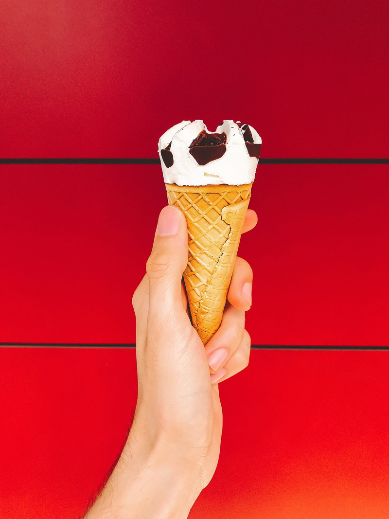 ice, human hand, temptation, sweet food, dairy product, finger, sweet, red, minimalist, one person, cone, person, snack, human body part, foodporn, ice cream