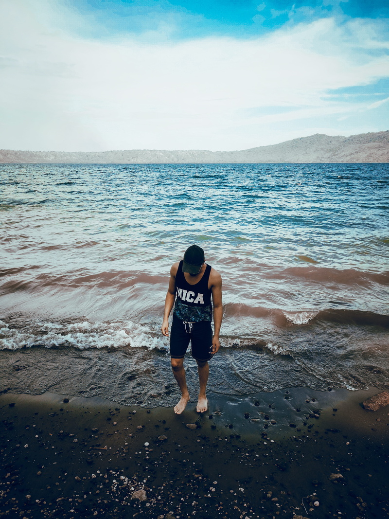 wearing, black, man, standing, sky, rear view, beauty in nature, water, sand, horizon over water, one person, leisure activity, real people, nicaragua