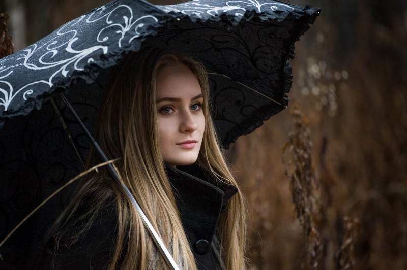 coats, black coat, blonde, women outdoors, women, rain, umbrella, straight hair, looking into the distance, long hair, 2K, overcoats, blue eyes
