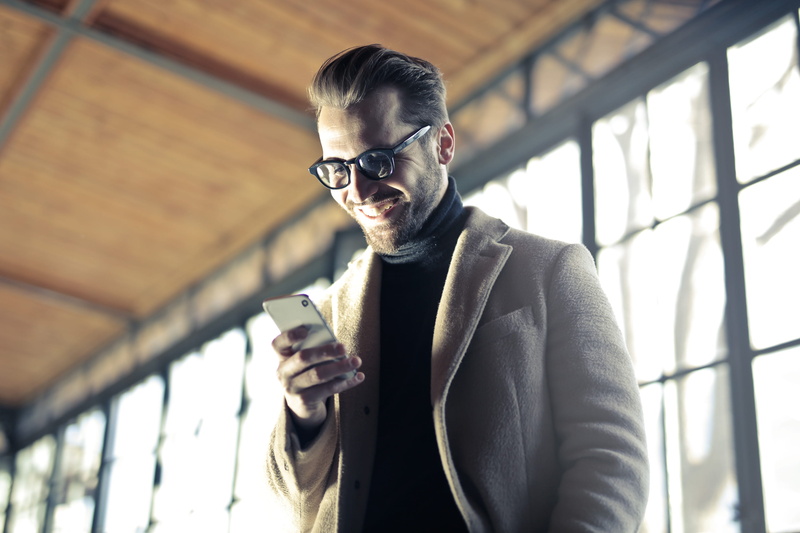 mobile, phone, communication, young adult, looks, outdoors, young, overcoat, cellphone, specs, 2K, caucasian, technology, lifestyles, portable information device