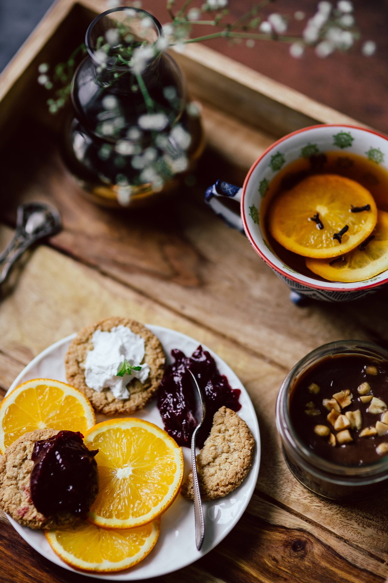 high angle view, brunch, chocolate mousse, meal, plate, focus on foreground, orange fruit, food and drink, gourmet, hotel, fruit, healthy eating, mousse
