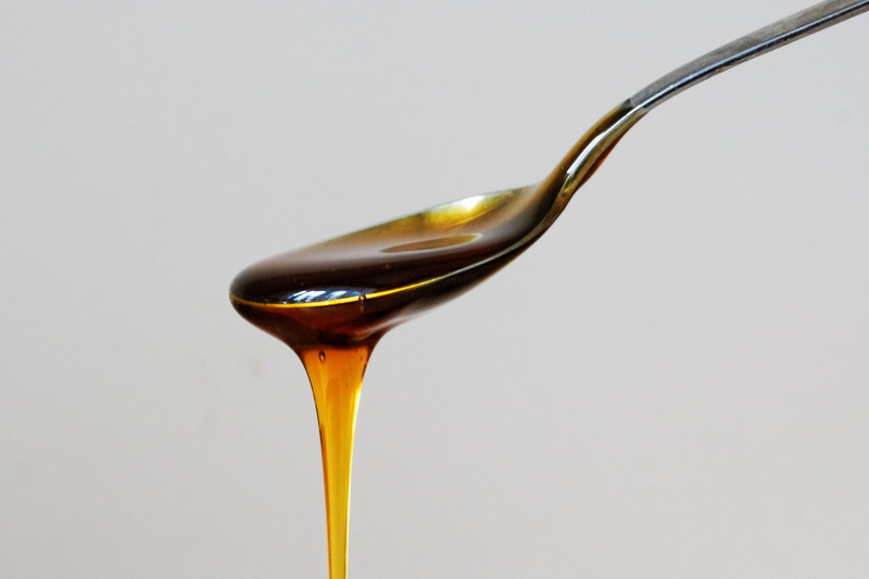 drink, 2K, teaspoon, indulgence, liquid, white background, eating utensil, isolated, honey, simplistic, single object, no people, indoors, freshness, pouring