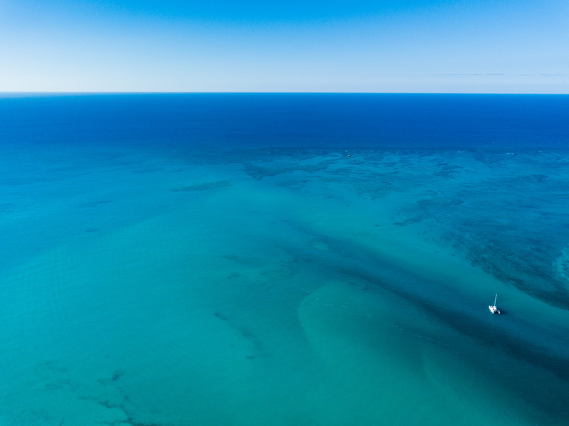 beach, caribbean, travel, land, horizon, beauty in nature, sand, ocean, horizon over water, reef, blue, nature, providenciales, sea, green, tranquil scene