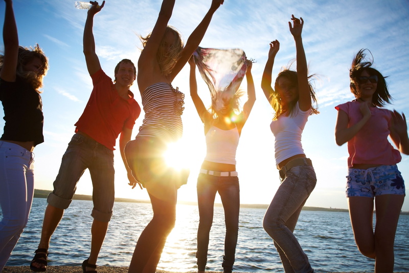 sunny, smiling, relaxation, shirt, lifestyles, party, recreational Pursuit, dance, standing, sunlight, celebration, people, white, lens Flare, outfit, beach