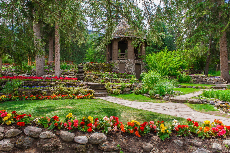 Banff, flowering plant, garden, no people, begonias, concrete, flowers, greens, footpath, garden path, trees, outdoors, the bushes, building exterior, brown