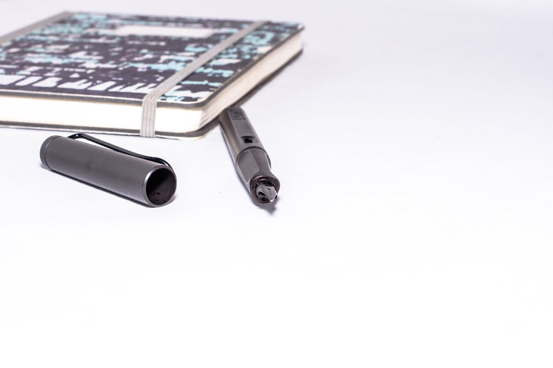 book, black, clip, study, closed notebook, leave, no people, two objects, technology, filler, writing utensil, metal, note, close-up, pen, business, booklet