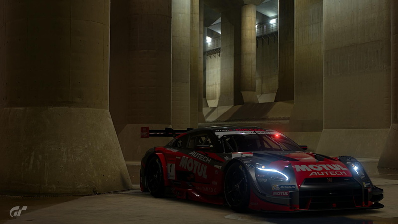land vehicle, architecture, toy car, car, racecar, garage, motor vehicle, red, Gran Turismo Sport, day, indoors, mode of transportation, Gran Turismo, illuminated