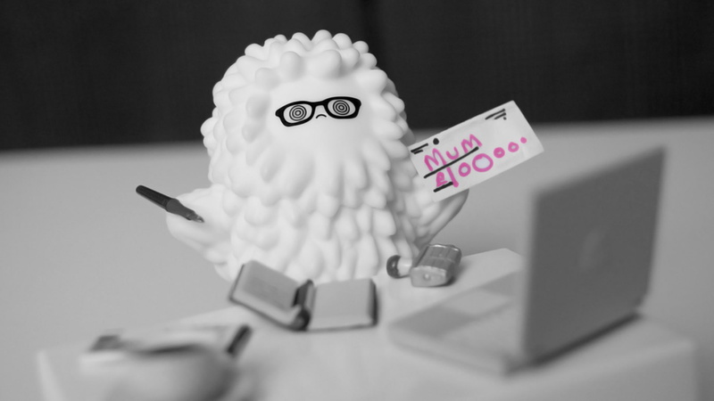 studio shot, close-up, indoors, text, communication, 1080P, representation, table, depth of field, western script, glasses, miniatures, closeup, emotion