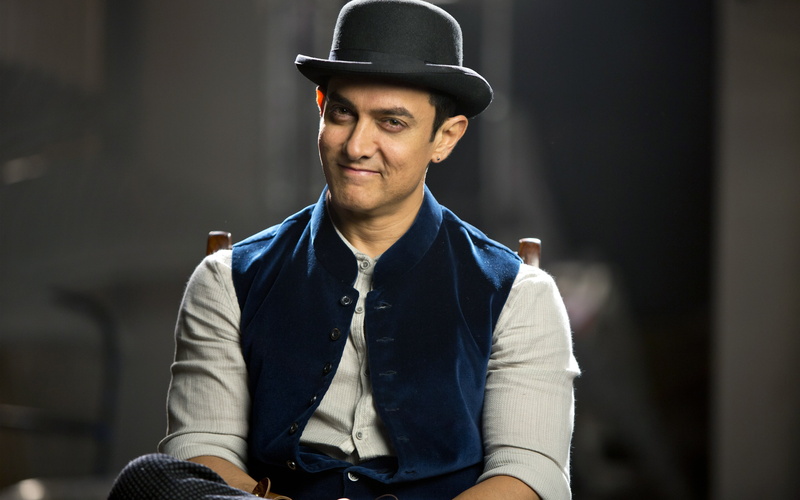 looking at camera, real people, one person, casual clothing, hat, sitting, three quarter length, handsome, k, 4K, cap, Khan, front view, young adult, lifestyles