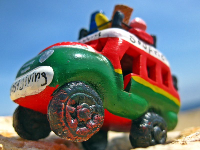multi colored, bus, colorful, text, metal, focus on foreground, yellow, toy, nature, helmet, truck, bush, 2K, vehicle, jiving, rasta, holiday, fun, transportation