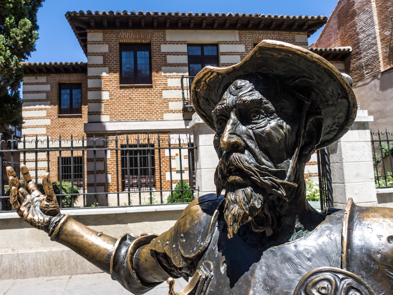 man, statue, water, book, representation, art and craft, building, outdoors, day, spain, male likeness, creativity, nature, photo, copper, cervantes, building exterior