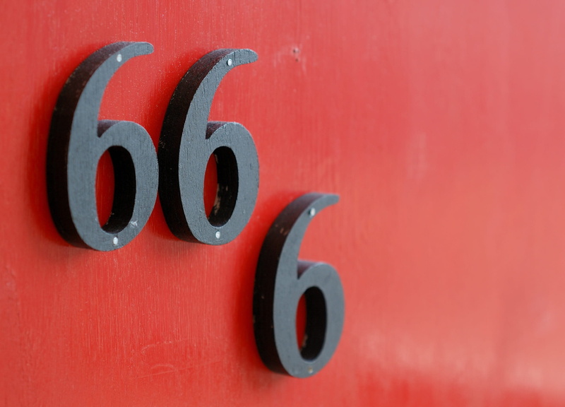 wood, text, Door, red, Black, colored background, Number, outdoors, Red, communication, still life, indoors, studio shot, orange color, metal, art and craft