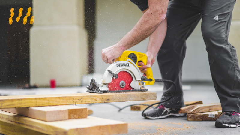 hand, industry, human hand, man, outdoors, work tool, dewalat, human body part, saw, plank, yellow, holding, wood, dewalt, sweatpants, men, black, body part