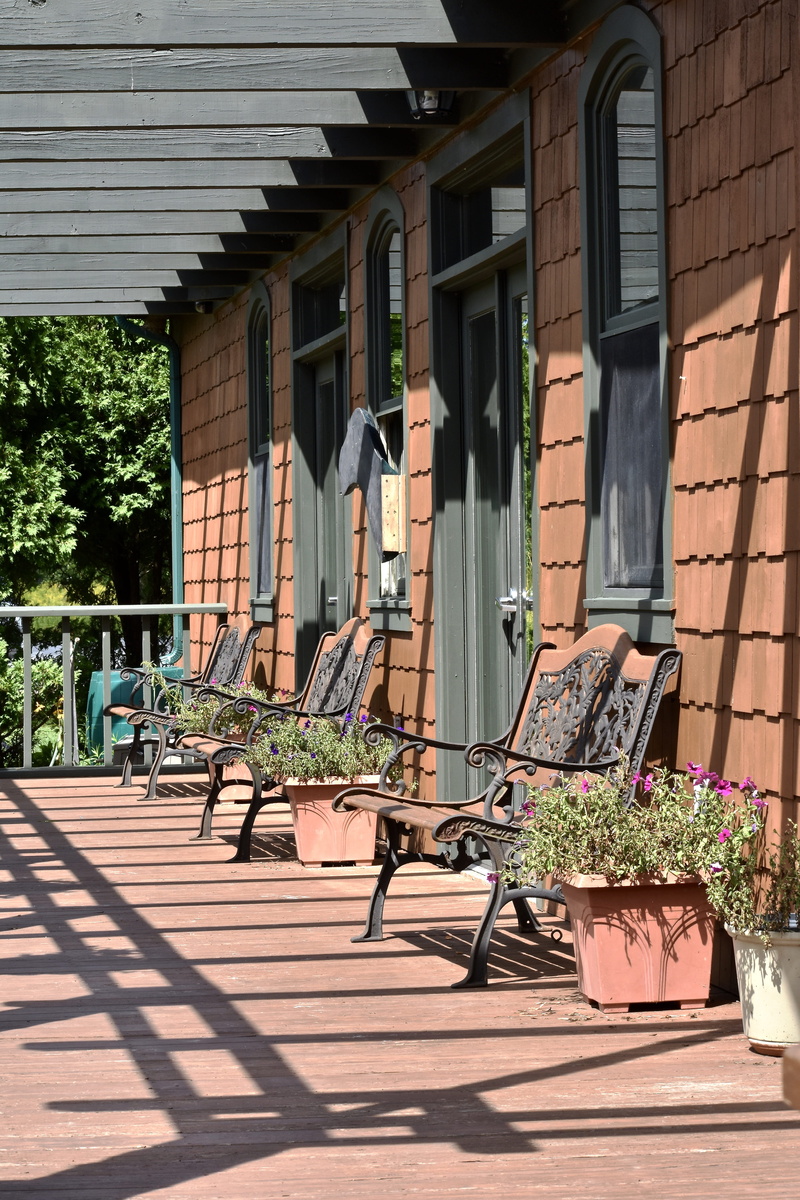 shadow, restful, outdoors, chair, plant, residential district, nature, summer, table, park, day, roof tile, sun, flower pot, warm, furniture, benches, building