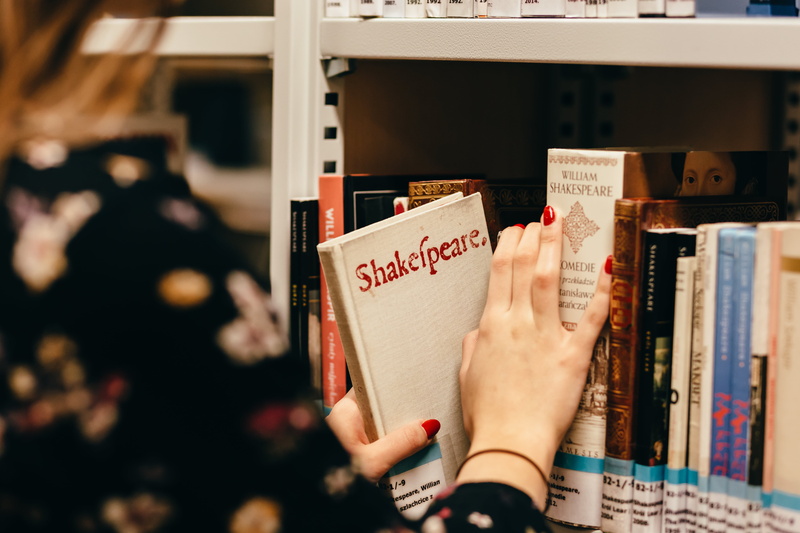 shelf, library, outdoors, women, top, close-up, arts culture and entertainment, publication, knowledge, text, indoors, woman, communication, finger, education