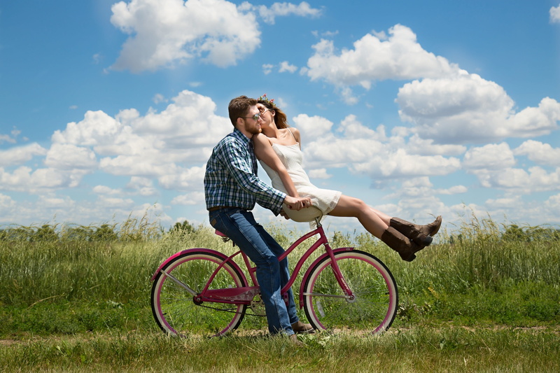young men, togetherness, together, adult, riding, engagement, young adult, men, outdoors, casual clothing, sky, two people, positive emotion, grass, cloud - sky