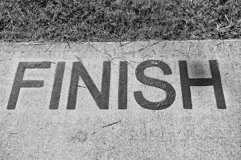 street, completion, writing, sunlight, end, road, grass, communication, text, single word, capital letter, day, western script, outdoors, sign, no people