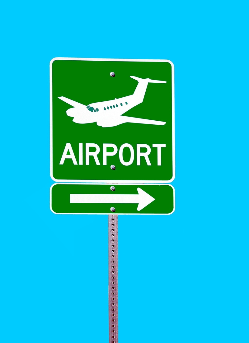 road, road sign, airplane, aircraft, no people, leaving, western script, blue background, nature, terminal, trip, icon, directional sign, signage, sky