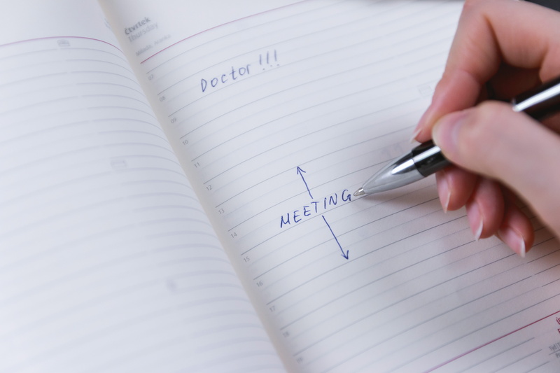 one person, handwriting, calendar, 5K, text, holding, book, writing, note pad, desk, finger, meeting, publication, paper, to do list, human hand, western script