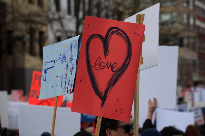 5K, close up, human, activist, tree, poster, heart shape, march, protest, people, incidental people, positive emotion, outdoors, western script, emotion