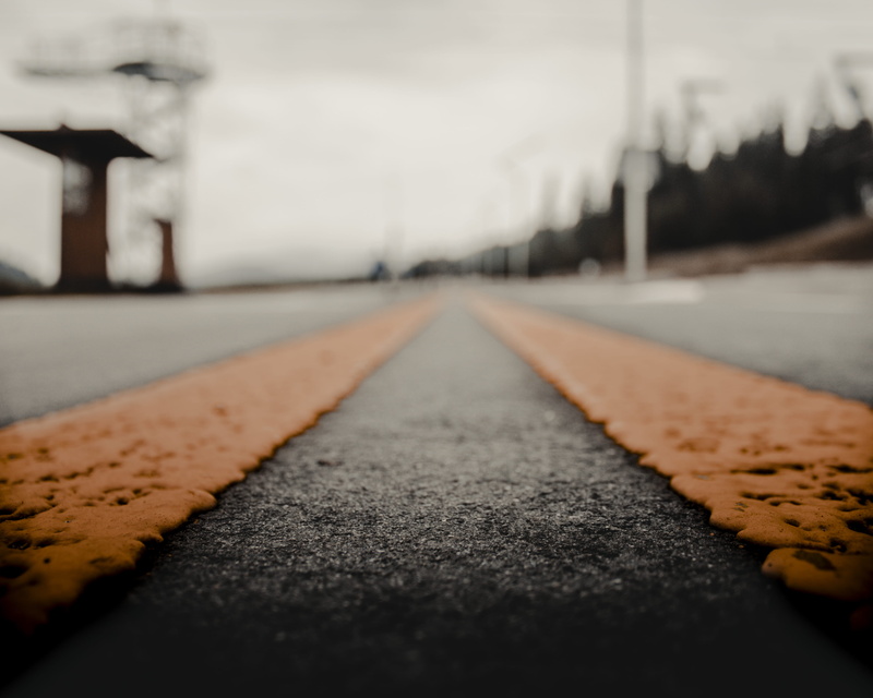 the way forward, photo, nature, transportation, selective focus, street, sign, surface level, dividing line, marking, no people, asphalt, pavement, vanishing point