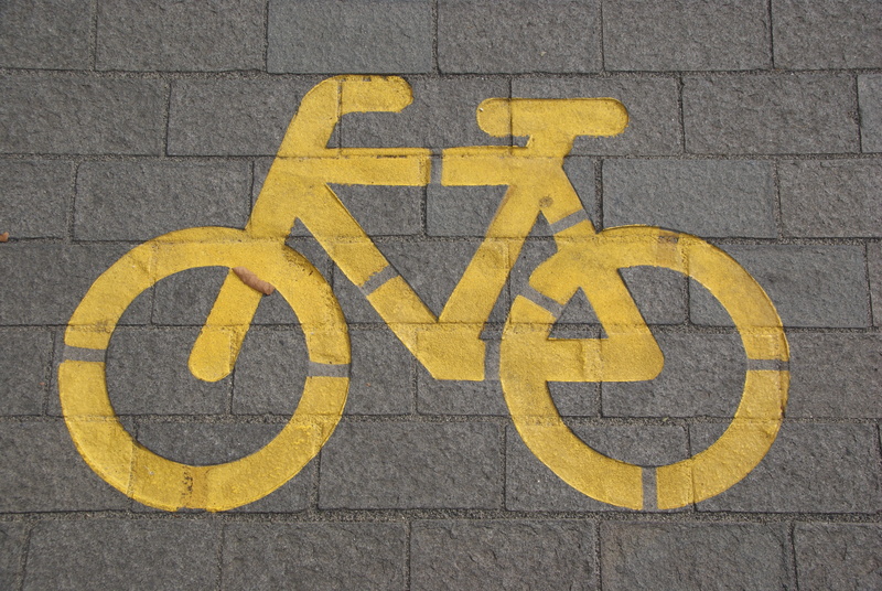 concrete, no people, symbol, route, cycling, street, transportation, yellow, architecture, road, safety, gray, safe, environment, drawing, black color