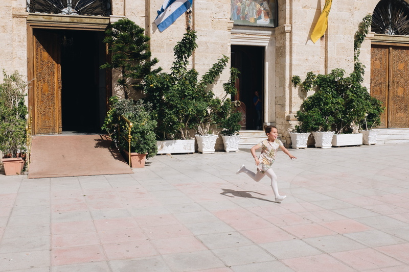 motion, home, one person, girl, young, plant, courtyard, architectural column, street, greece, running, nature, footpath, child, floor, sunlight, childhood